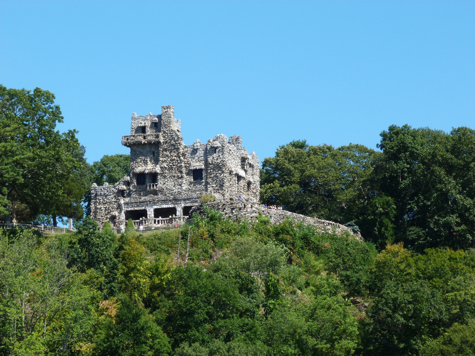 Stone exterior of Gillette Castle above trees in East Haddam, Connecticut